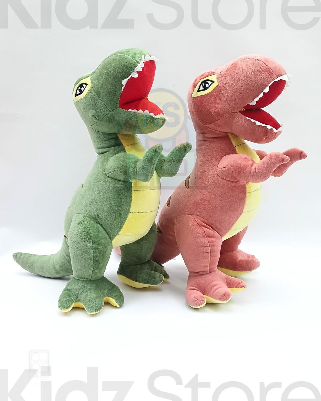 Two plush dinosaur toys, one green and one pink, on a white background with 'Kidz Store' branding.