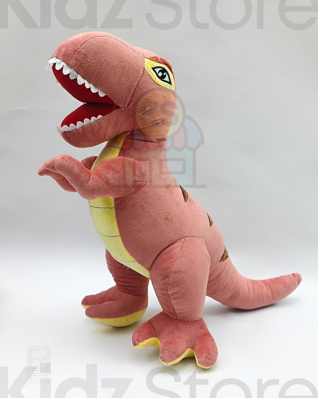 Plush dinosaur toy with open mouth on a white background, branded 'Kidz Store'.