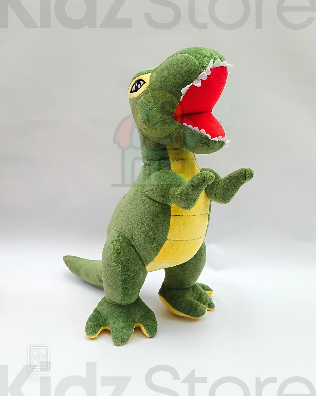 Green dinosaur plush toy with a red mouth on a white background