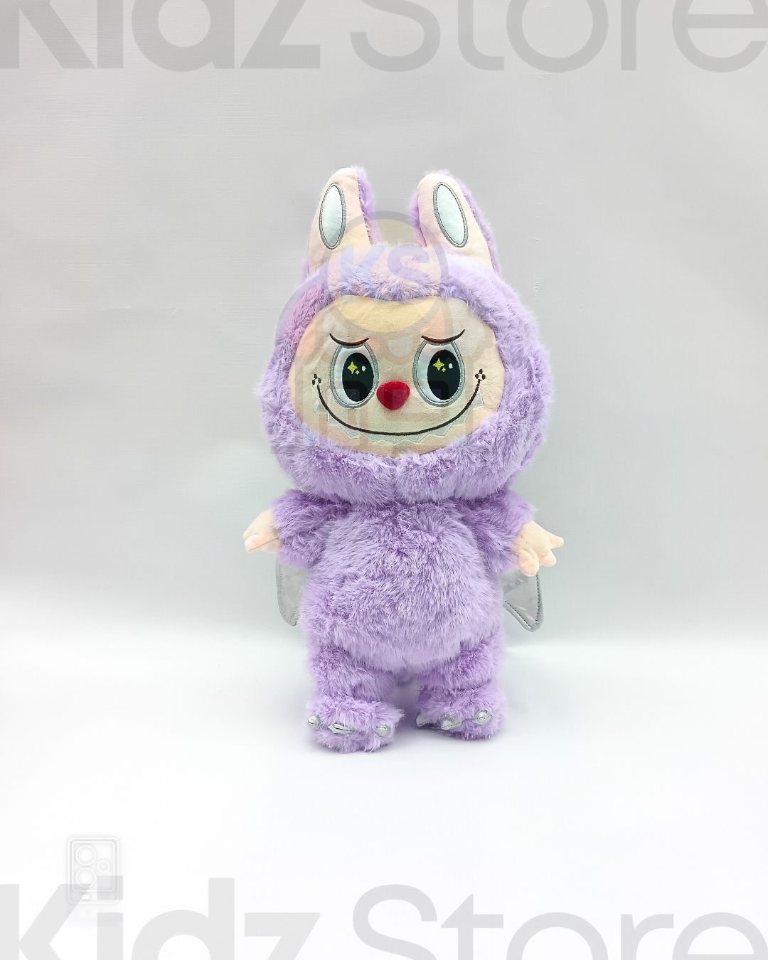 Plush toy with a purple costume on a white background