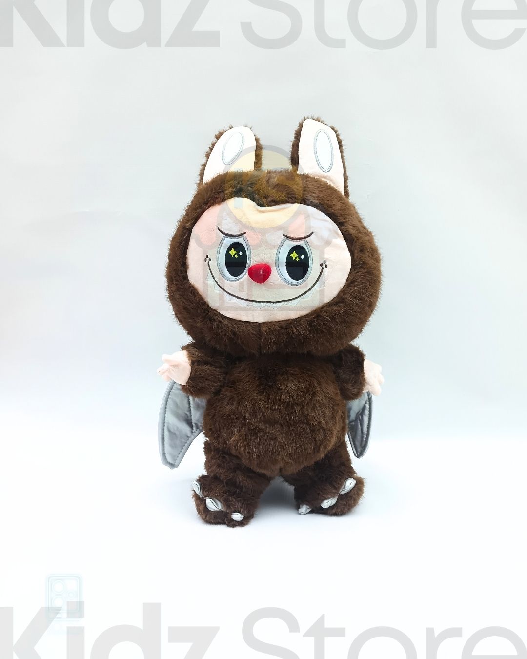 Plush toy resembling a cartoon character with brown fur and white accents on a white background.