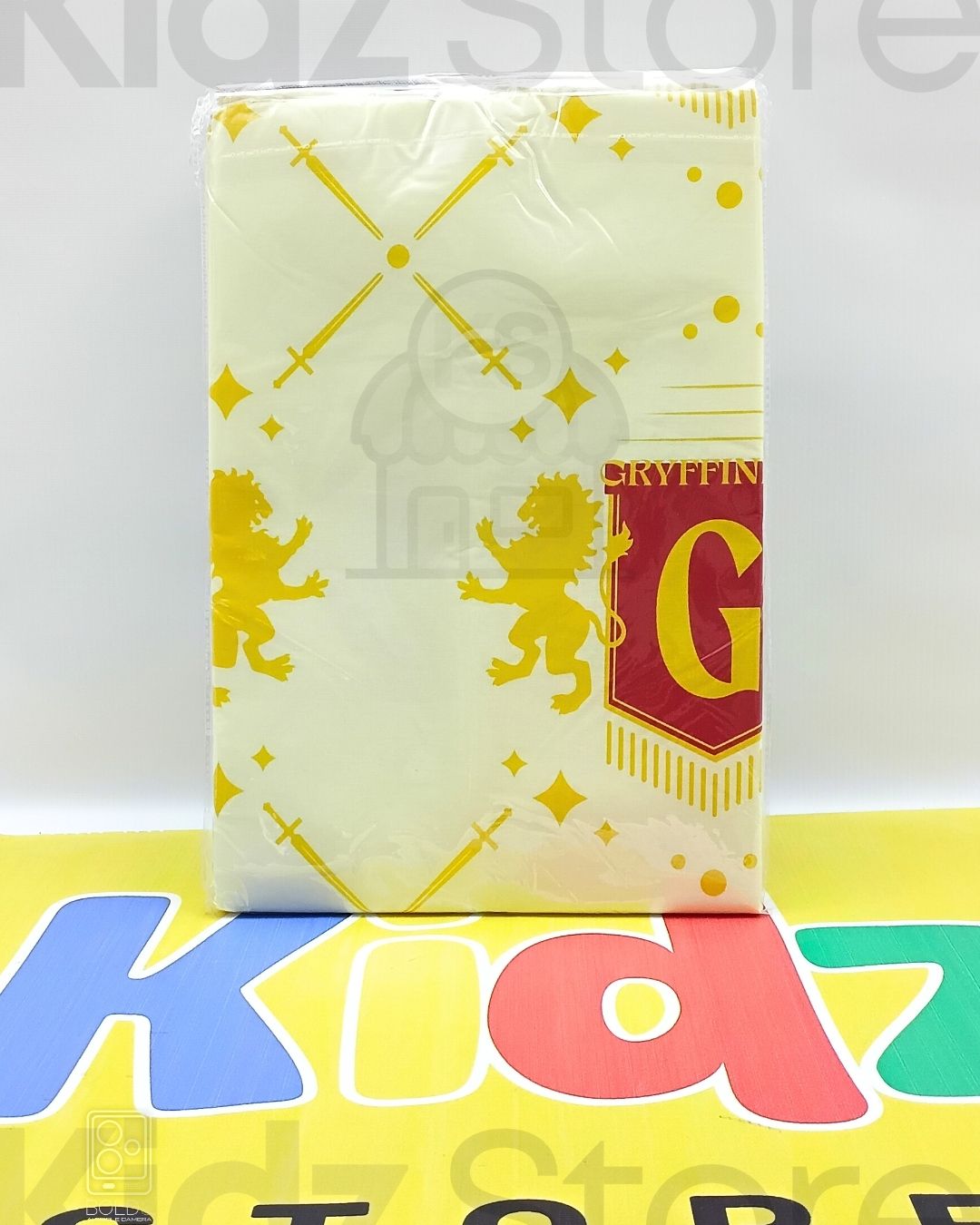 Notebook with Gryffindor design on a colorful background