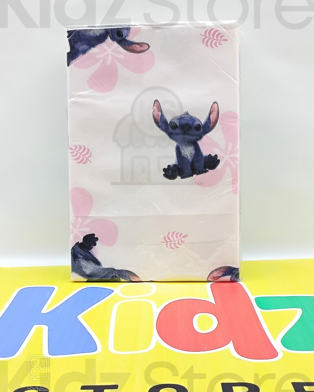 Product packaging with cartoon character on a white background, featuring 'Kidz Store' branding.