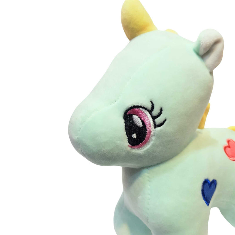 Plush toy unicorn with a heart on a white background