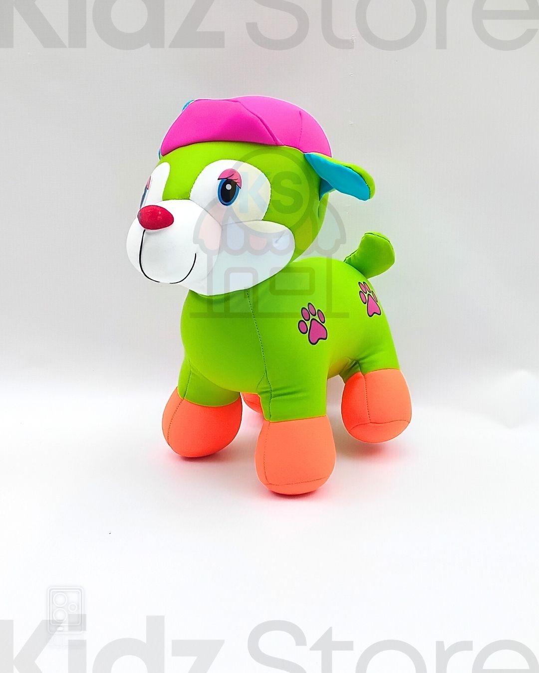 Colorful plush toy dog with a pink hat on a white background