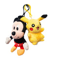 Plush keychains of Mickey Mouse and Pikachu on a white background